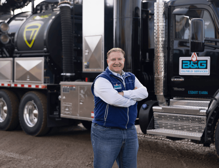 business owner standing before truck